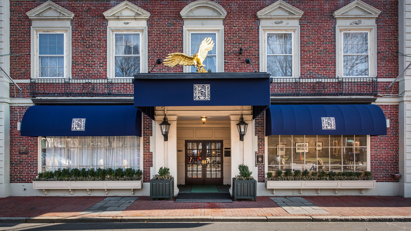 Image of the front entrance to the Hawthorne Hotel with golden eagle statue. Hawthorne Hotel, a member of Historic Hotels of America since 1991, located in Salem, Massachusetts