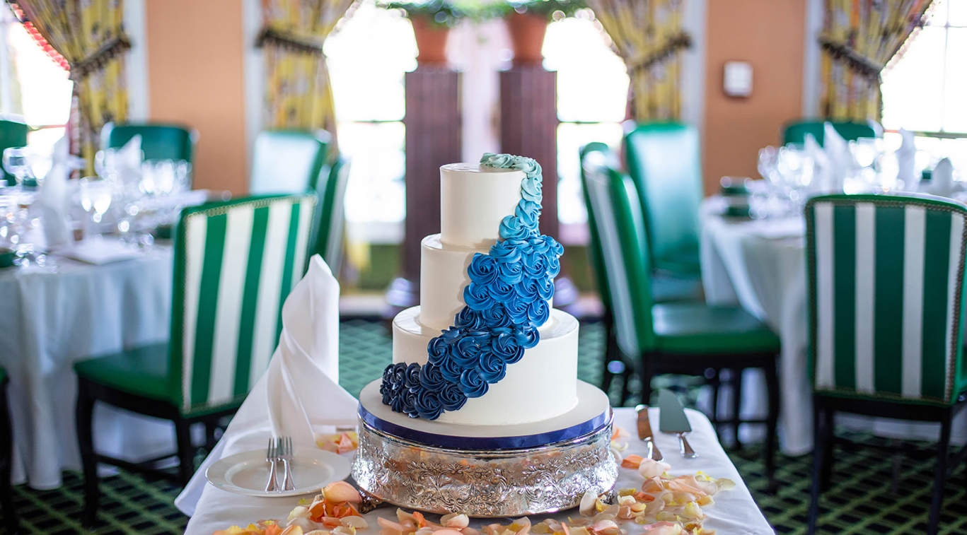 Image of decorated wedding cake with ombre blue roses. Grand Hotel, a member of Historic Hotels since 2001, dates to 1886. It is located in Mackinac Island, Michigan.