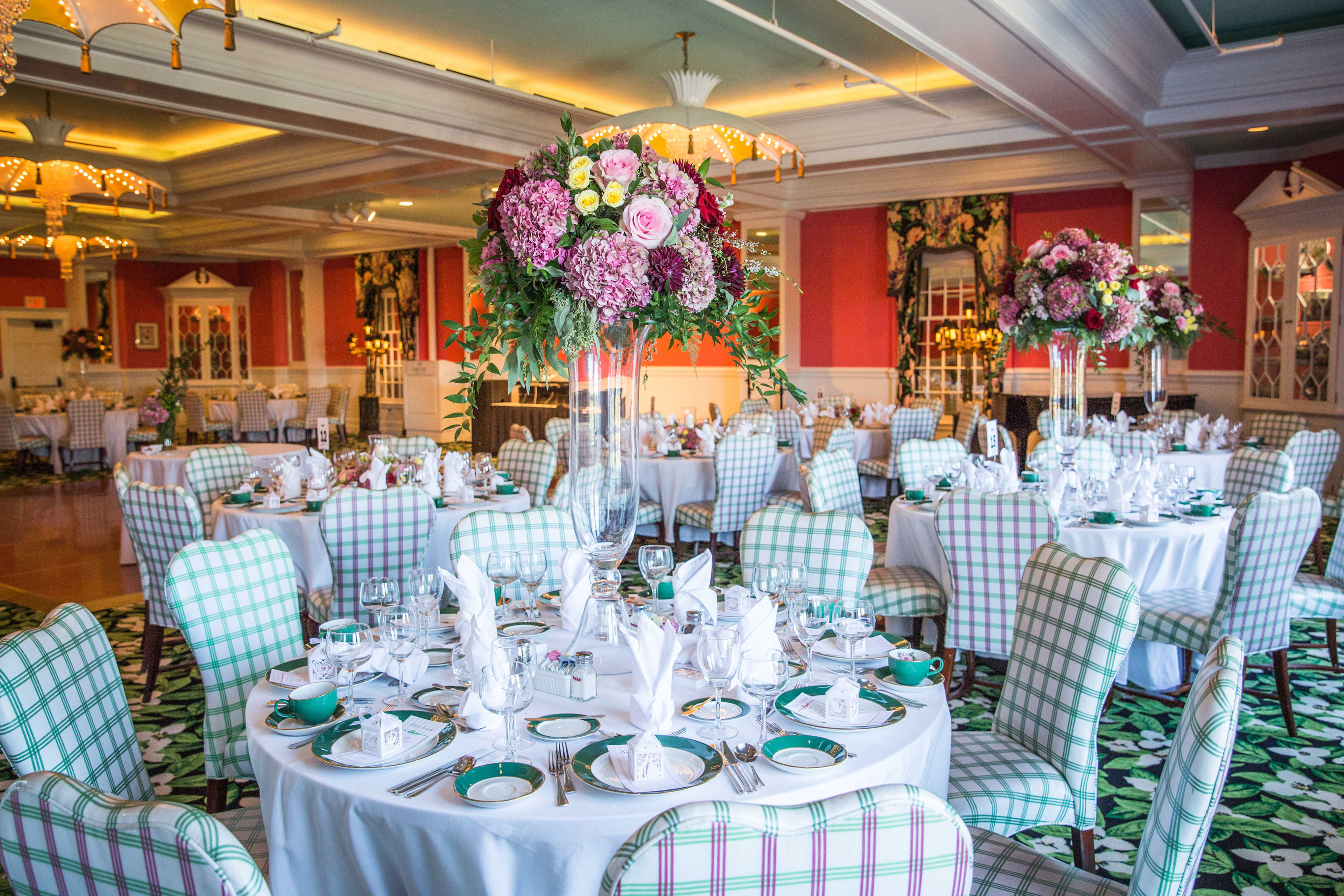 Image of event taking place at the Grand Pavillon with tables elegantly decorated. Grand Hotel, a member of Historic Hotels since 2001, dates to 1886. It is located in Mackinac Island, Michigan.