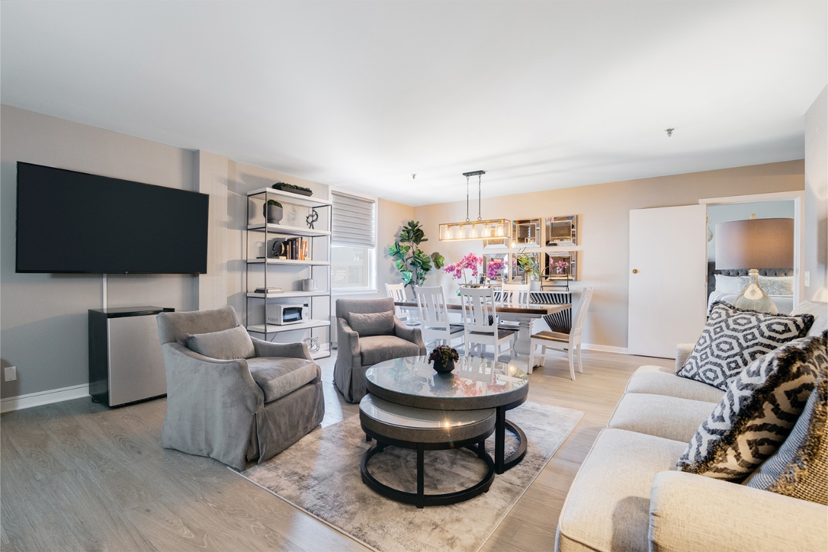 Image of the Christopher Reeve Suite at The Nassau Inn (1756), a member of Historic Hotels of America since 2024. Pictured are several chairs and a couch arranged around a low table.