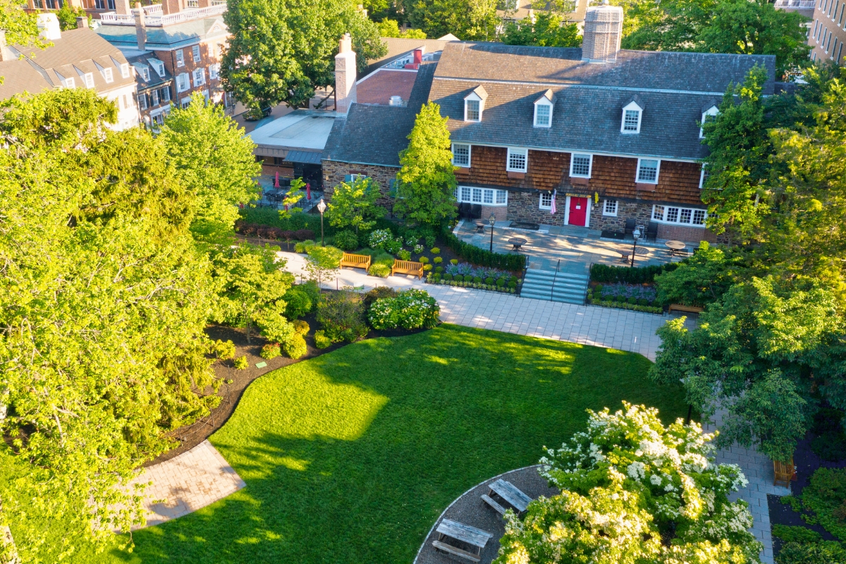 Image of the grounds at The Nassau Inn (1756), a member of Historic Hotels of America since 2024. Pictured is the inn building among lawns and trees.