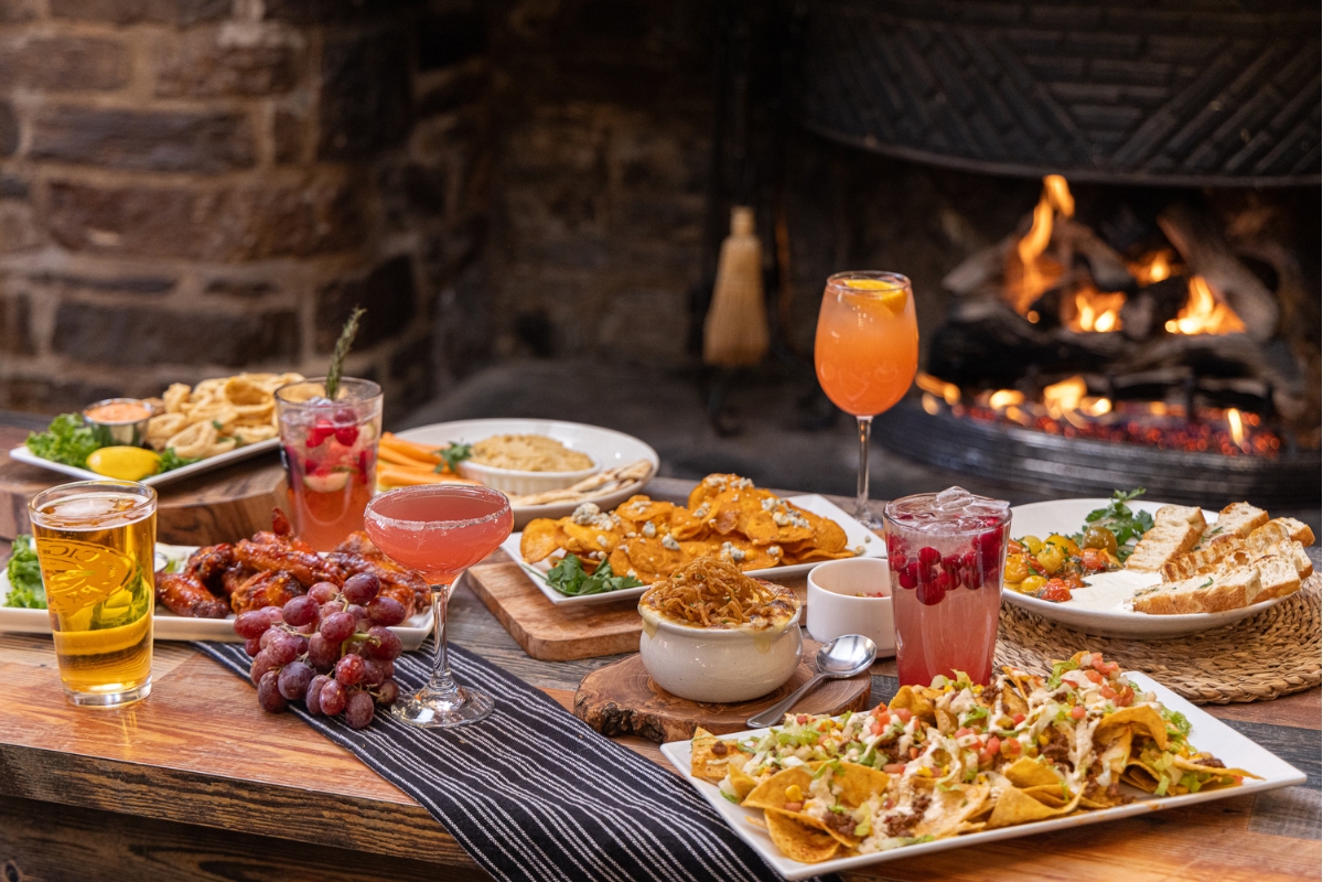 Image of food at The Nassau Inn (1756), a member of Historic Hotels of America since 2024. Pictured is a selection of dishes and beverages.