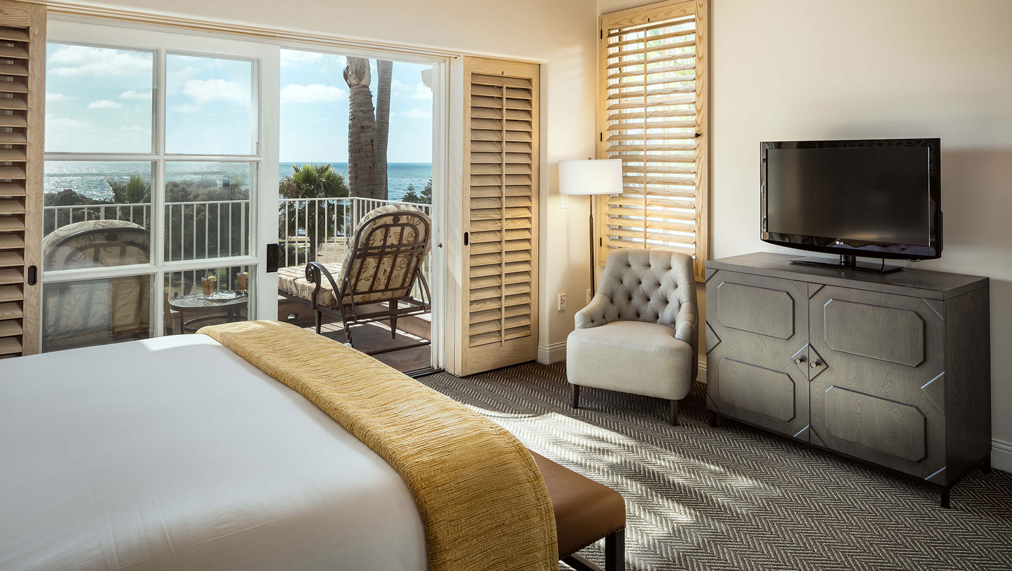 Image of La Valencia Suite Bedroom and Balcony at La Valencia Hotel, 1926, Member of Historic Hotels of America, in La Jolla, California.