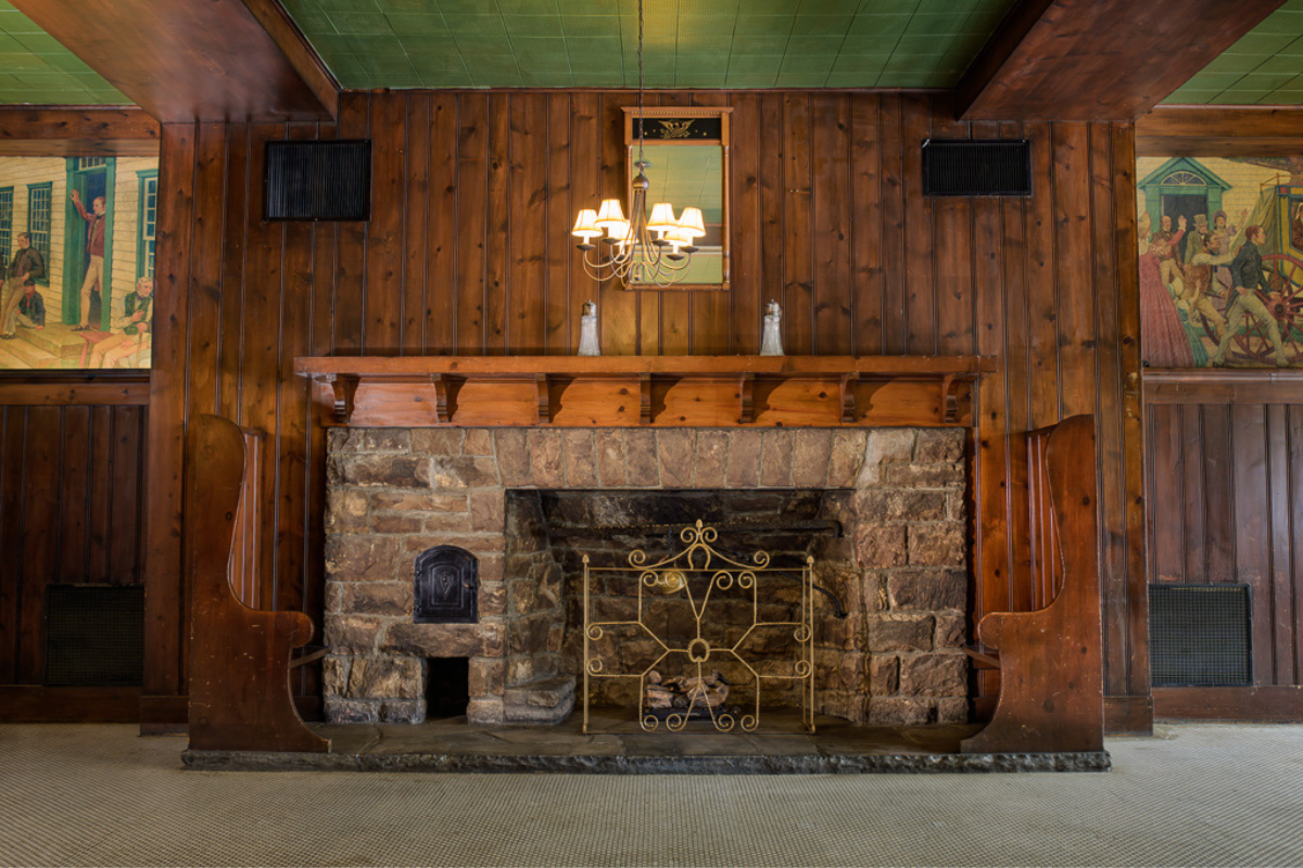 Image of fireplace in Pioneer Hall at the George Washington Hotel in Washington, Pennsylvania, is a member of Historic Hotels of America since 2023.